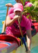 woman in pink sure rowing boat